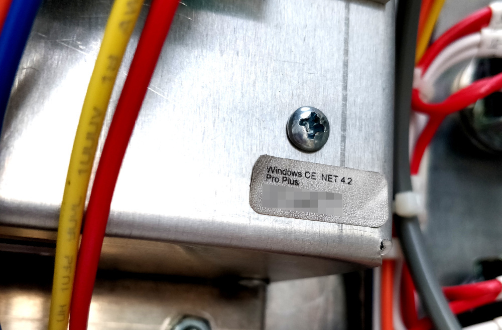 Windows CE .NET 4.2 sticker behind the computer panel
